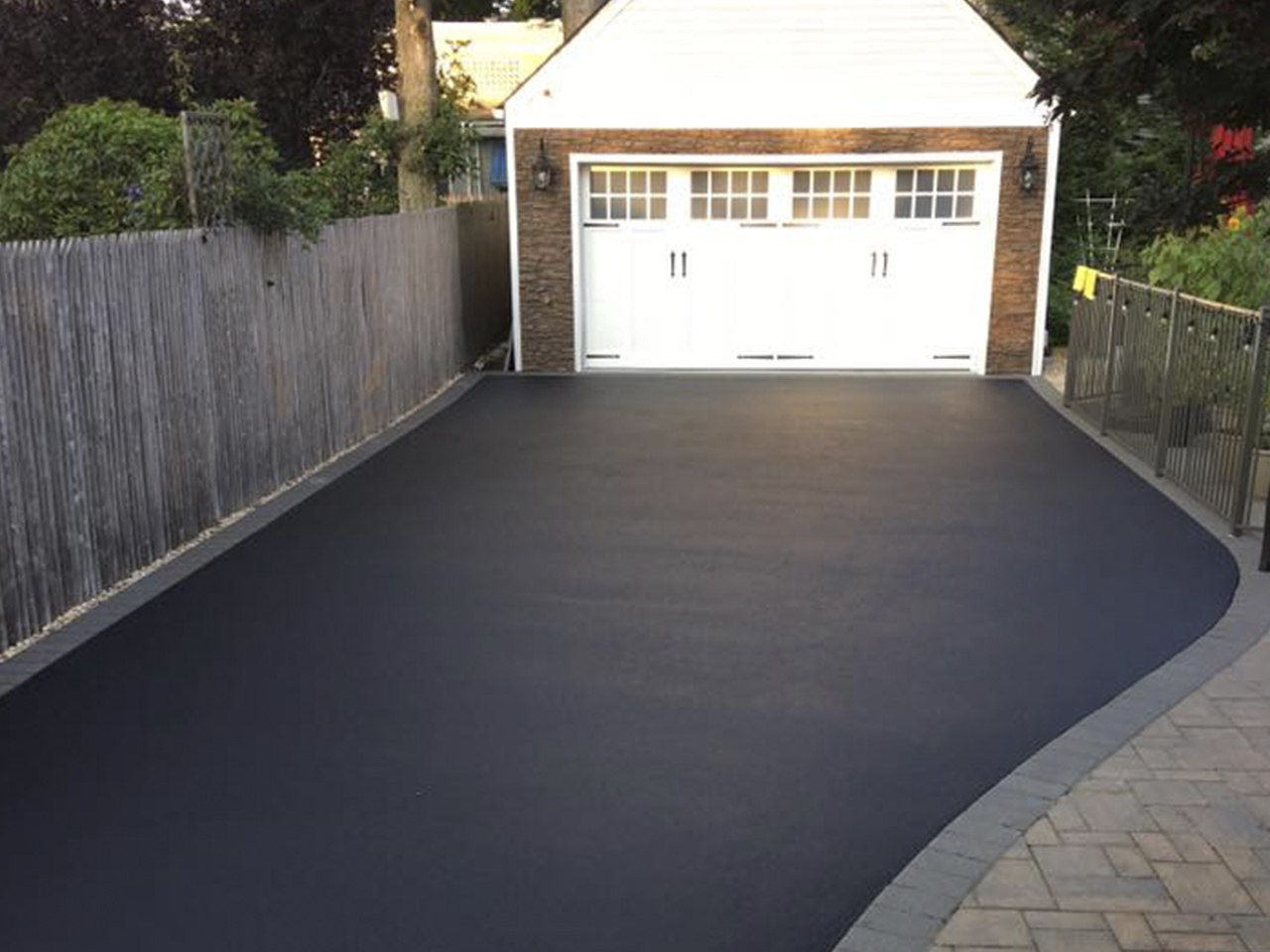 An impeccably paved driveway by Affordable Patio, enhancing the property's exterior appeal