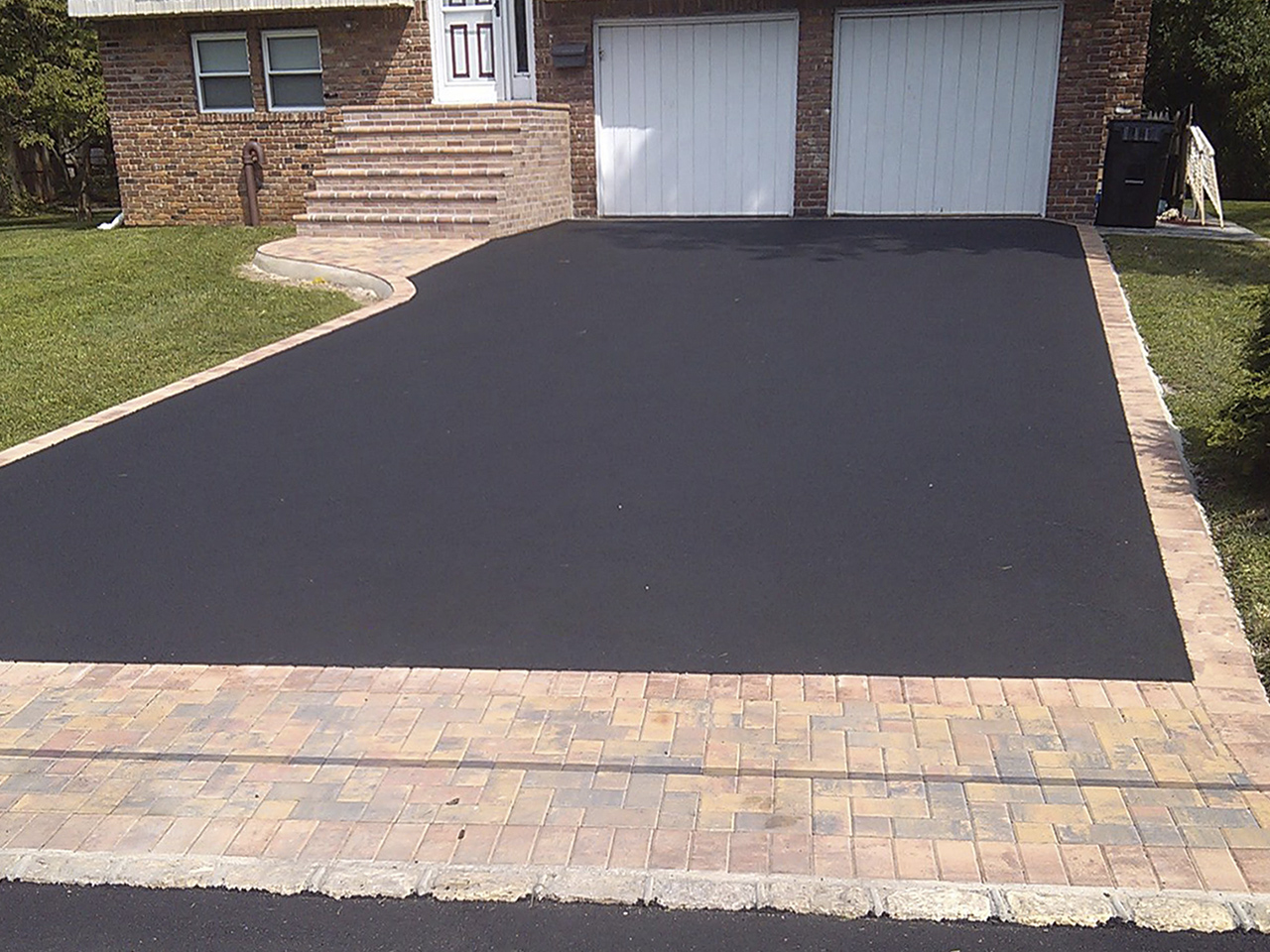 A spacious and well-defined driveway created by Affordable Patio, providing ample parking space.