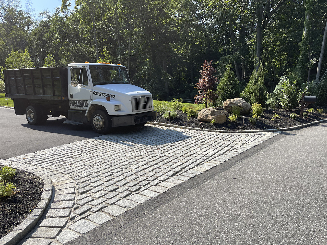 A skillfully paved driveway by Affordable Patio, ensuring long-lasting durability and strength
