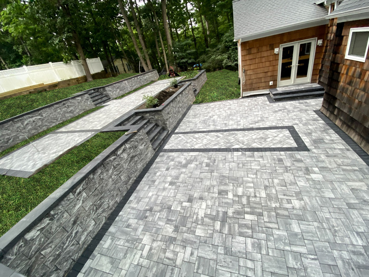 Cheaply priced limestone retaining wall next to a patio
