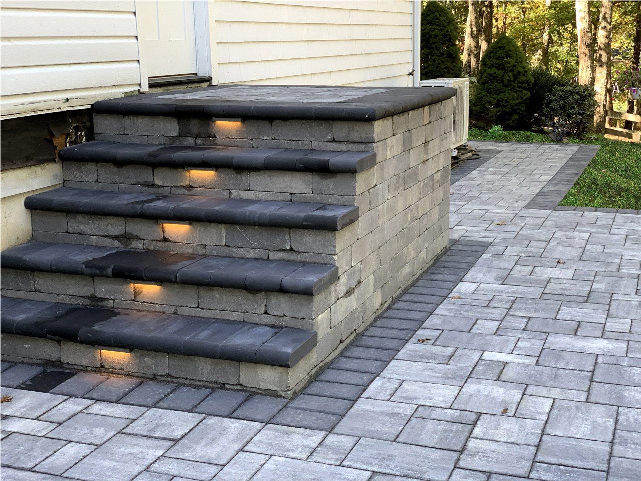 Natural stone steps with an earthy color palette that harmoniously blend with the landscape