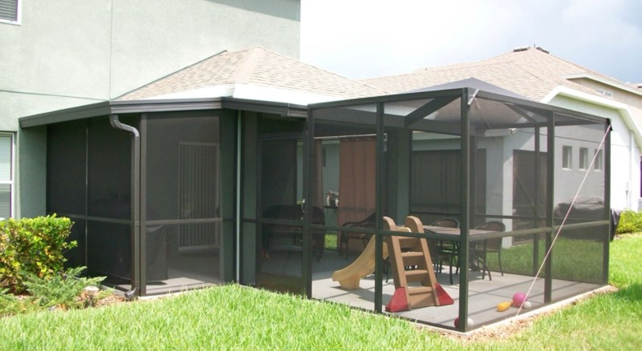 L-shaped enclosure with a centered door. Budget-friendly ideas for your lanai screen door replacement.