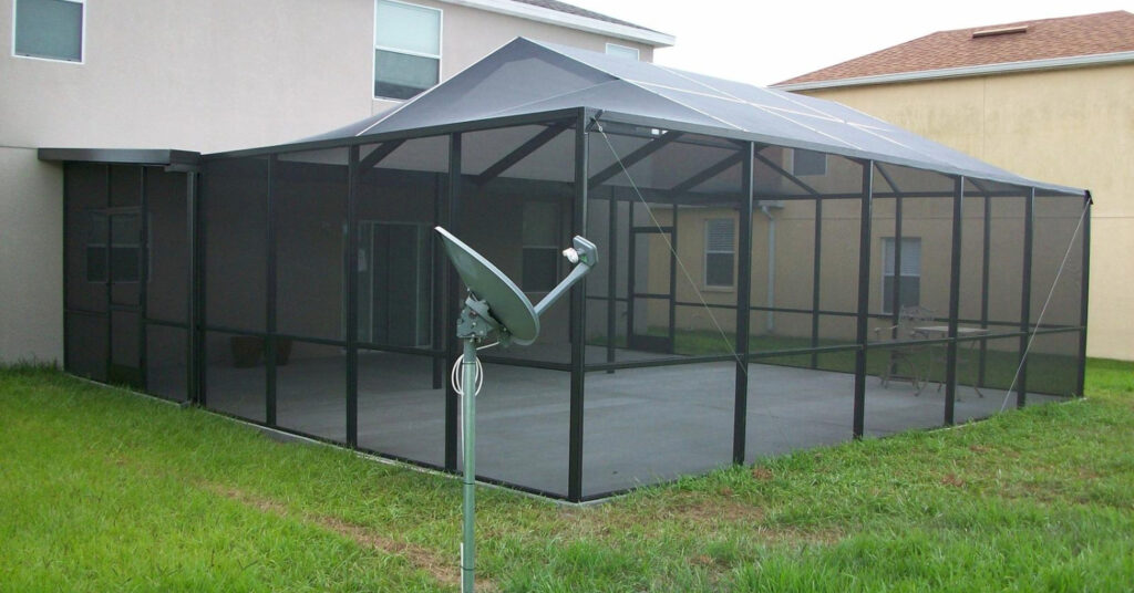 Large enclosure showing a side entry. Simple tips for a lanai screen door replacement.