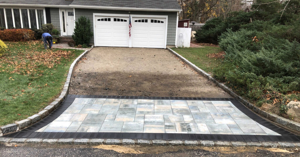 A close-up of earth-toned interlocking stones with a clean border, illustrating why these are the best pavers for driveways.