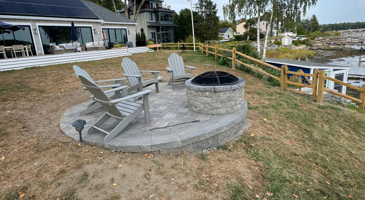 An elegant, permanent backyard fire feature built with premium materials, reflecting the typical fire pit installation cost in Nassau County for 2026.