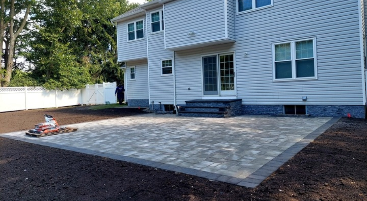 Finished grey-toned stone surface representing the standard high-end cost to install a brick paver patio.