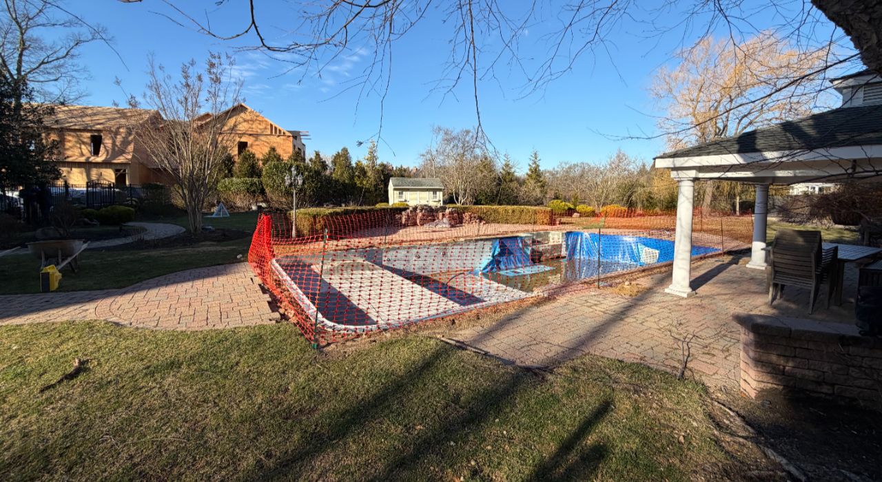 Above ground pool with pavers showing stone around pool, compacted base area, and drainage planning