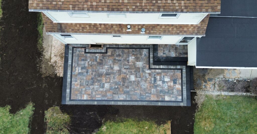 Best Patio Contractors Nassau County consultation with homeowner reviewing patio plans and estimate details