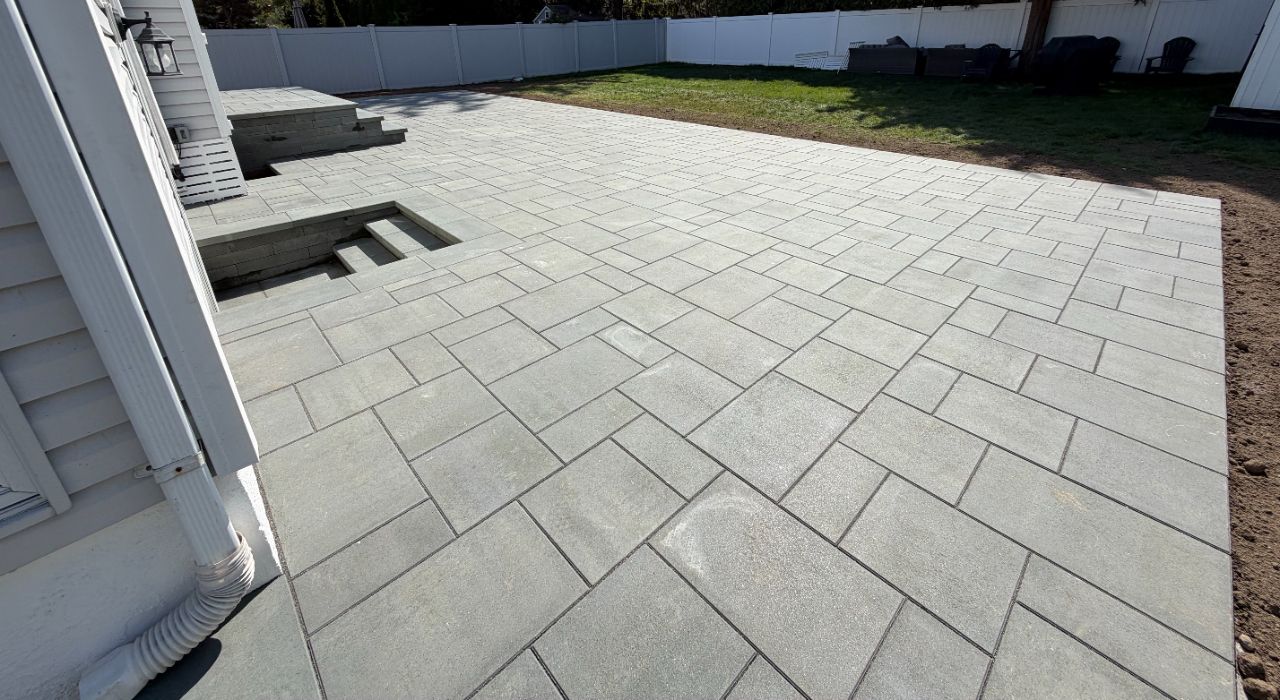 Licensed patio contractor checklist showing paver patio portfolio, written estimate, and Nassau County project planning