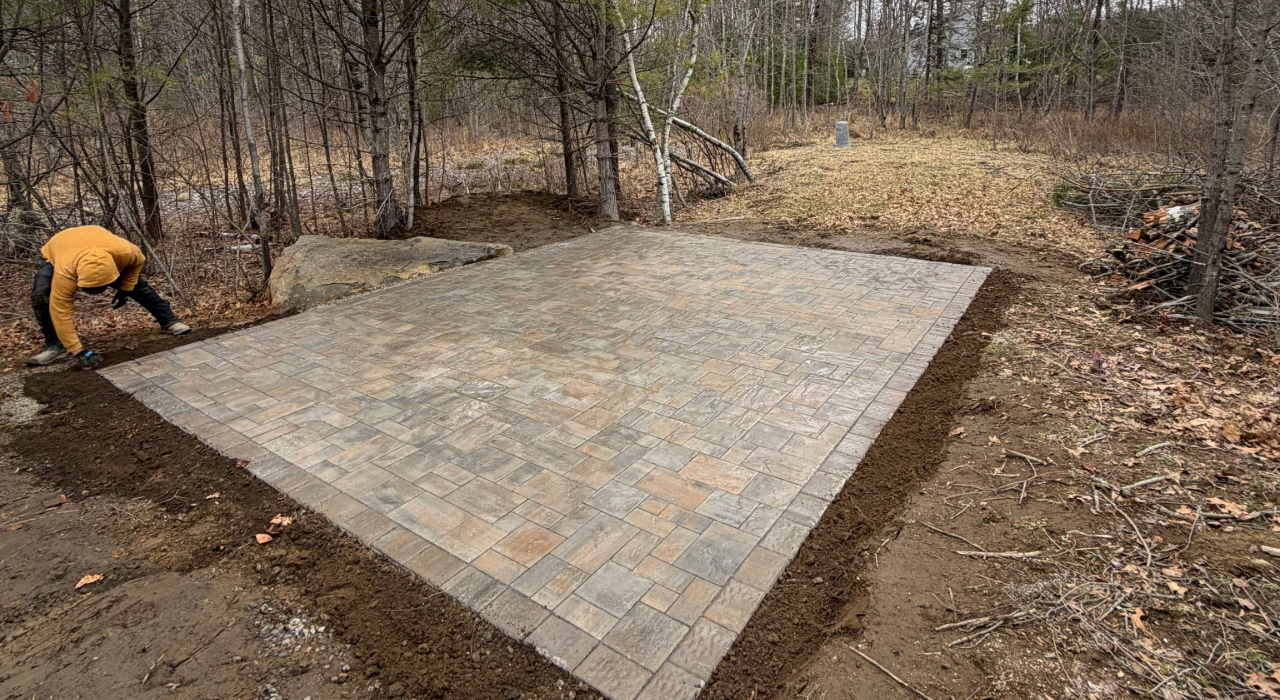 Looking across this freshly laid beautiful stone surface clearly highlights the aesthetic differences in the paver patio vs concrete patio.