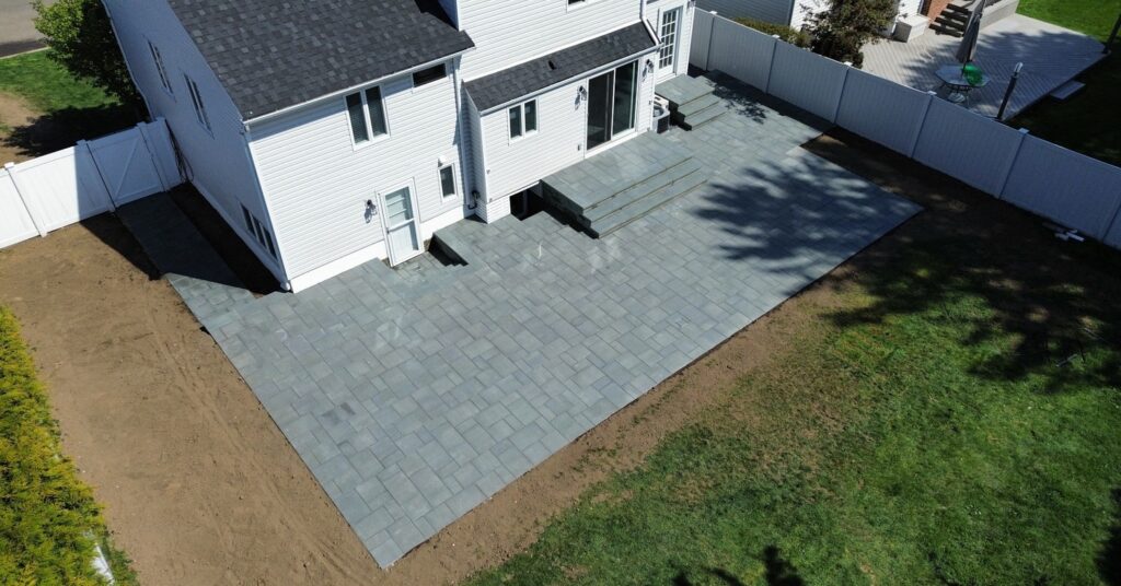 Driveway pavers Hempstead NY home with clean paver entrance, border detail, and curb appeal upgrade
