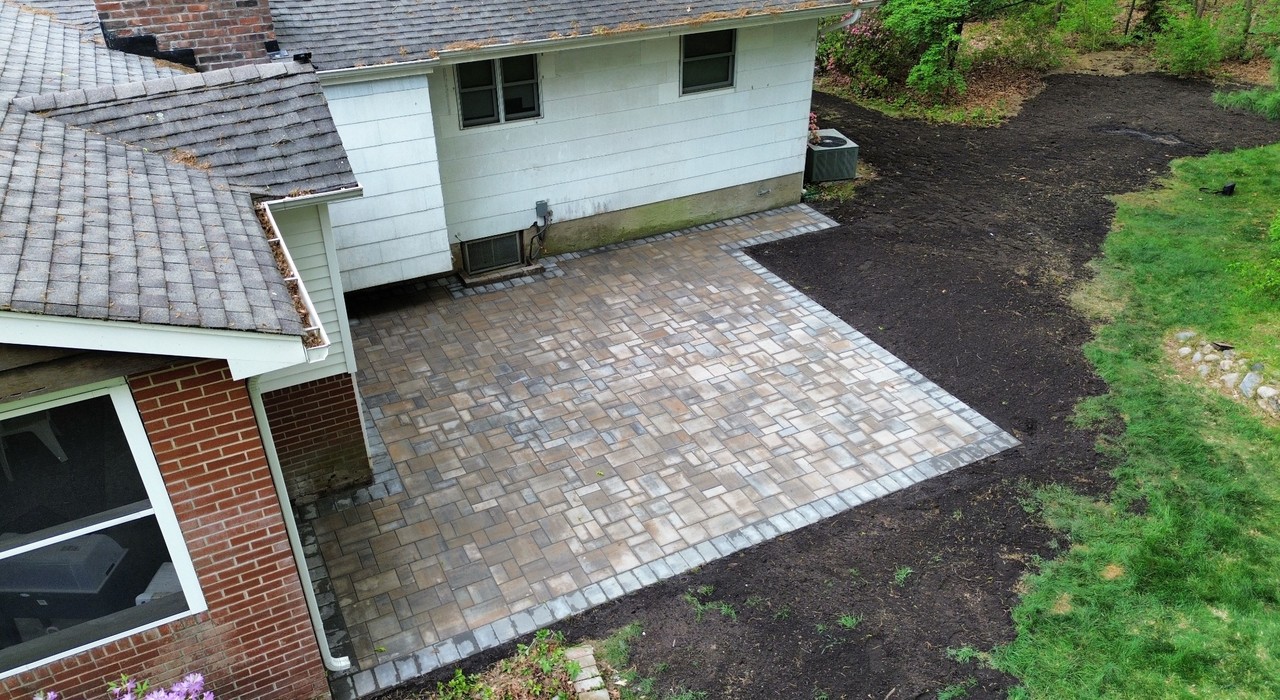 Driveway pavers Hempstead NY home with clean paver entrance, border detail, and curb appeal upgrade