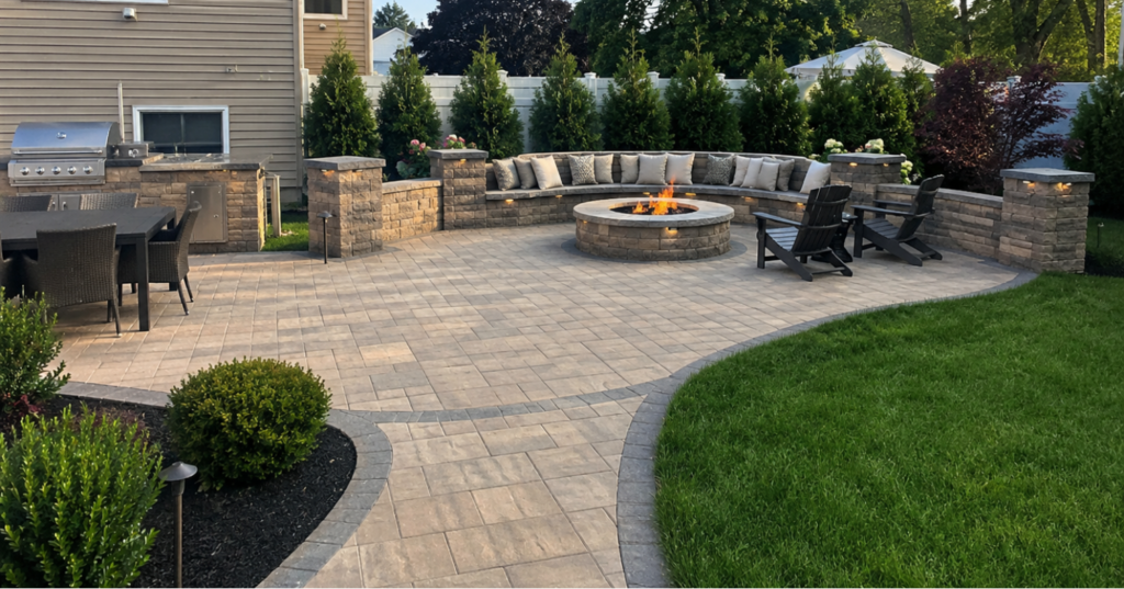 Outdoor living Massapequa NY backyard with paver patio, fire pit seating, and walkway connection