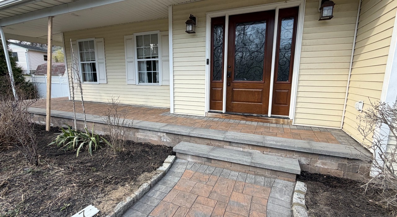 Patio contractors Garden City planning a backyard patio with paver samples, layout notes, and cost details