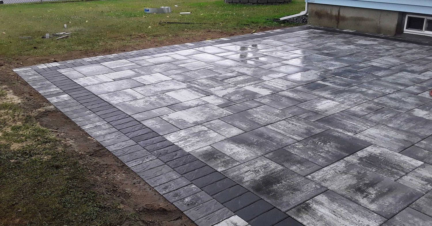 A luxury oceanfront pool deck featuring winter patio care on Long Island