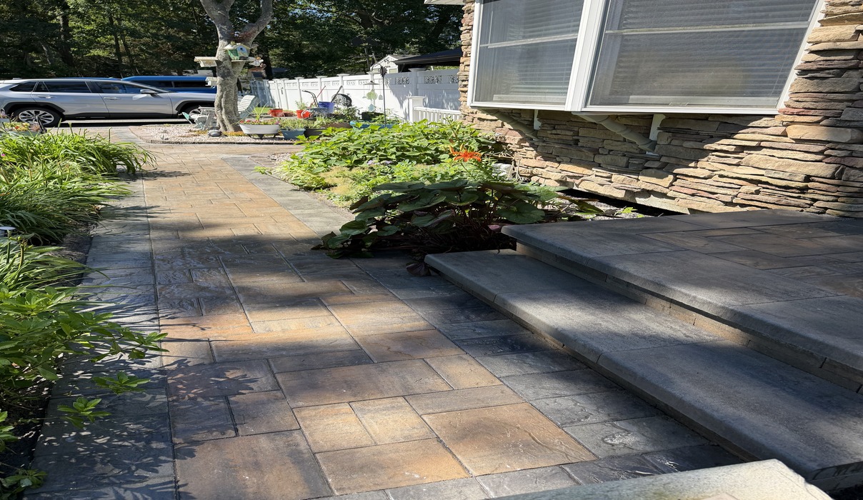 A paver walkway leading to entry steps comparing granite steps vs bluestone steps in Dover