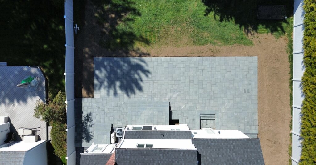 how to install paver driveway base preparation in Suffolk County with compacted stone and driveway pavers