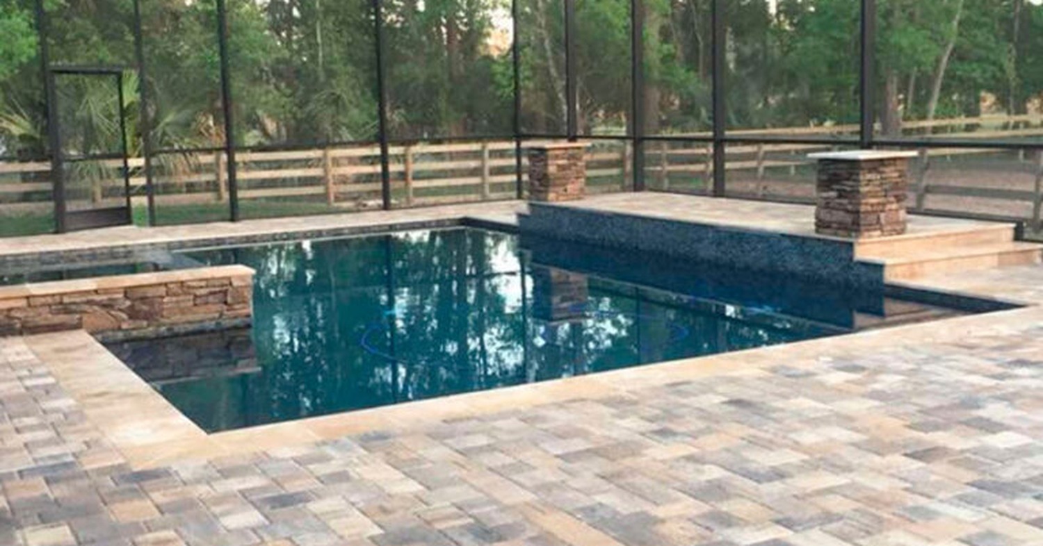 A luxury backyard pool deck cage estimating how much does a lanai cost in Florida