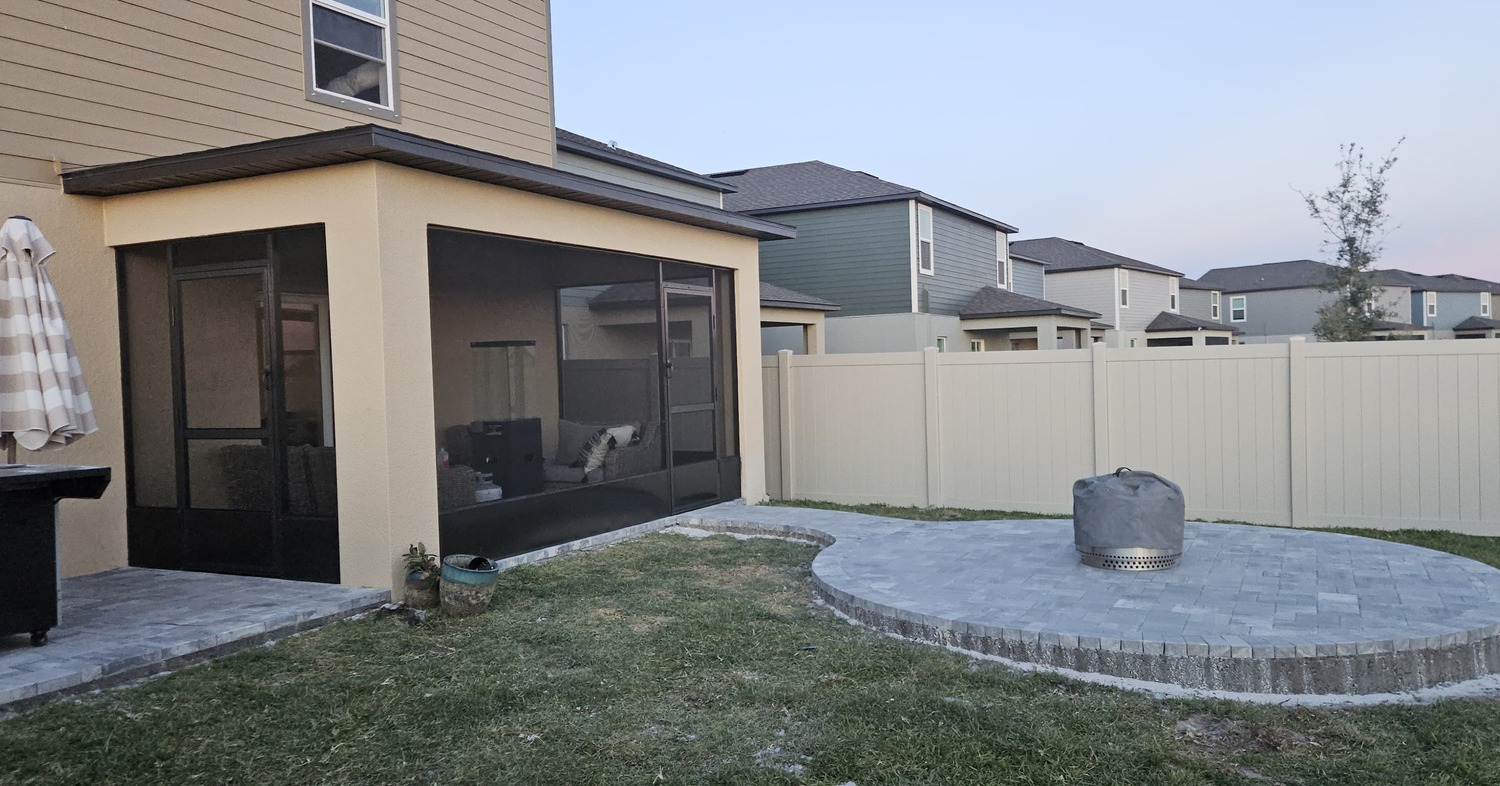 Raised circular stone deck showcasing beautiful outdoor patio ideas with fire pit setups