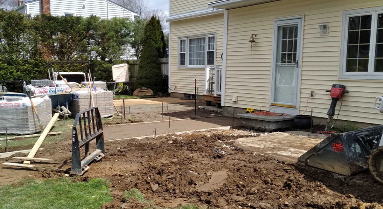 An active outdoor excavation site prepared by a professional patio contractor in Concord.