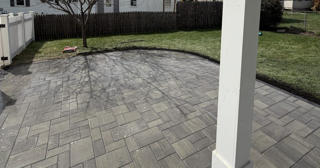 Newly laid grey stone pavers completed by professional patio contractors in Nashua.