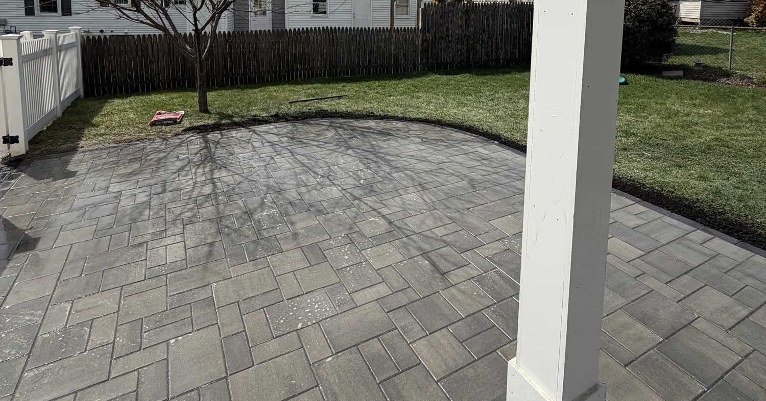 Newly laid grey stone pavers completed by professional patio contractors in Nashua.