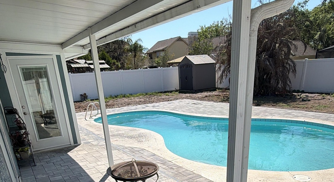 Poolside layout comparing the design of a paver patio vs stamped concrete