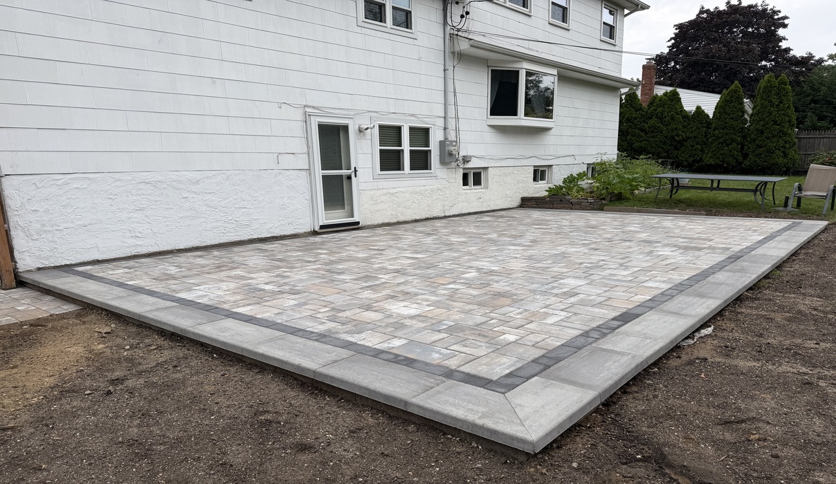 An overhead view of custom stone hardscaping measuring paver patio cost in Dover.