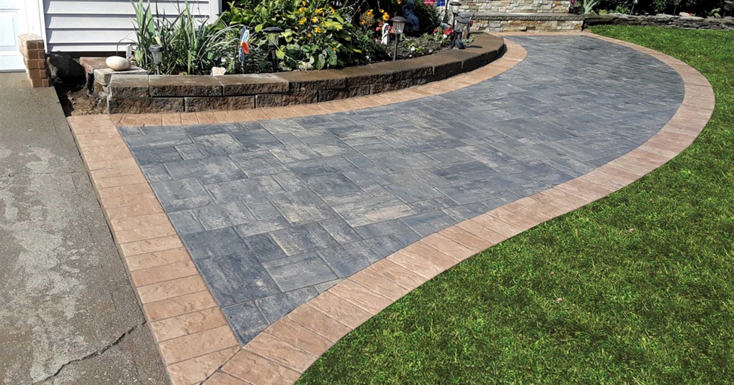 A curved paver path alongside garden beds demonstrating a realistic walkway renovation cost